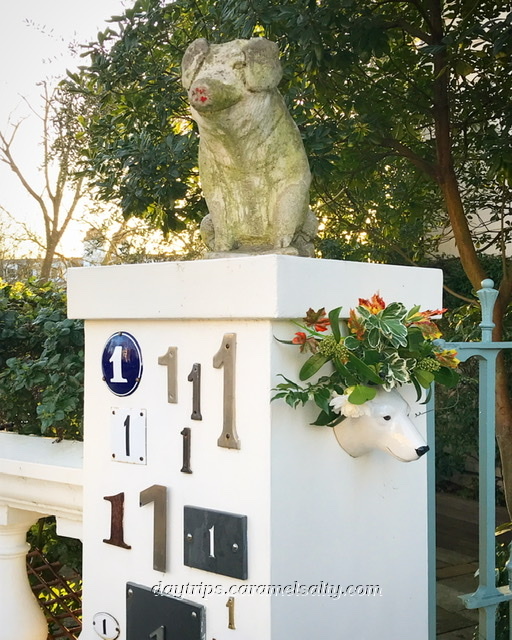 A Pig Statue On A House Gate